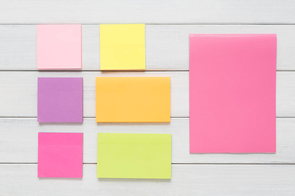 Stationery supply - sticky notes paper on wood - Photo, Image