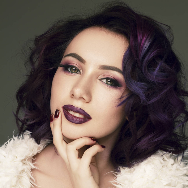 Portrait of young beautiful woman with violet make up and purple - Фото, изображение