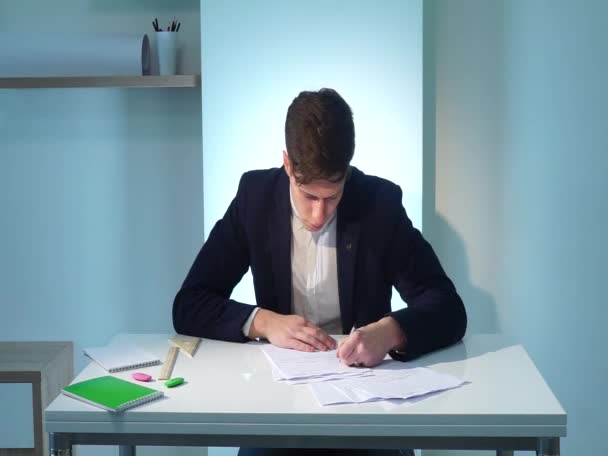 Man writing documents - Кадри, відео