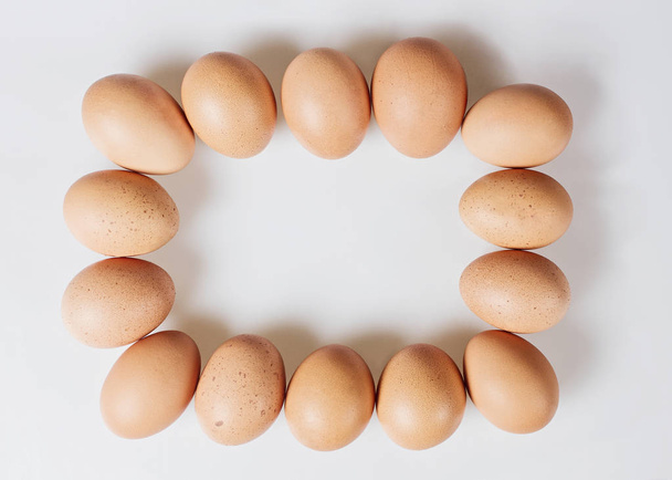 Organic eggs on a white background, top view - Zdjęcie, obraz