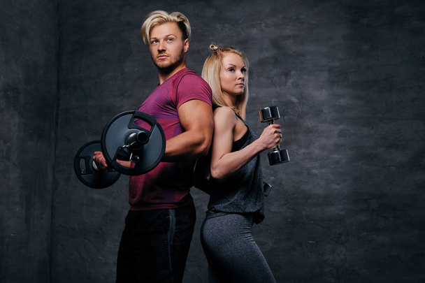 Sporty man and slim blond woman - Photo, Image