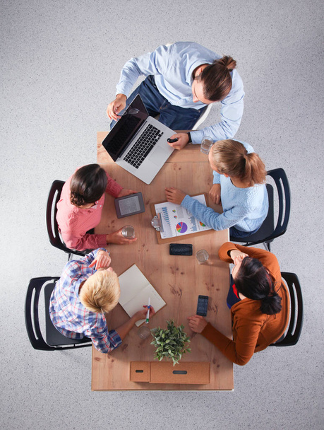 Business people sitting and discussing at meeting, in office - Photo, Image