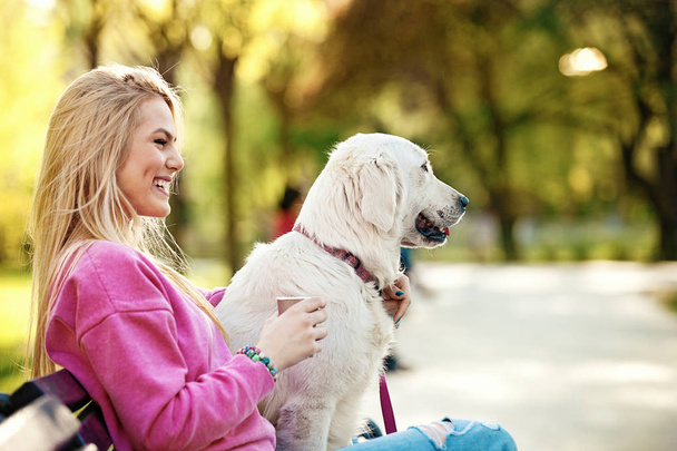 Woman enjoying park with dog - Foto, Imagen