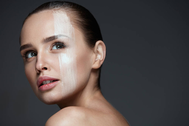 Facial Makeup. Sexy Woman With Cream Mask On Face Skin - Valokuva, kuva