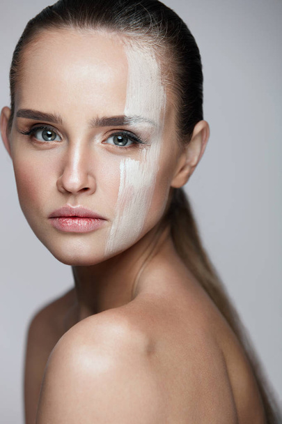 Cosmetics. Sexy Woman With Cream Mask Across Face. Skin Care - Photo, image