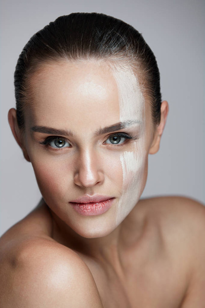 Cosmetics. Sexy Woman With Cream Mask Across Face. Skin Care - Фото, изображение