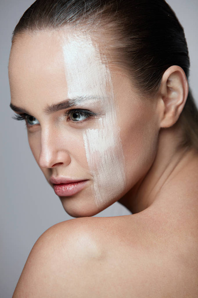 Cosmetics. Sexy Woman With Cream Mask Across Face. Skin Care - Zdjęcie, obraz