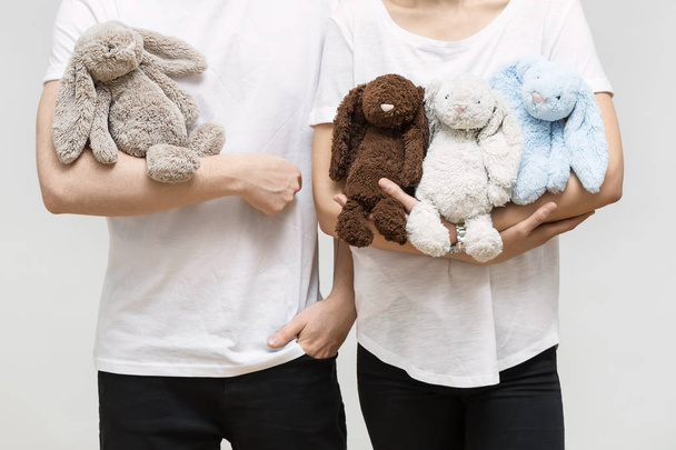 Couple with toy rabbits - Foto, Imagen