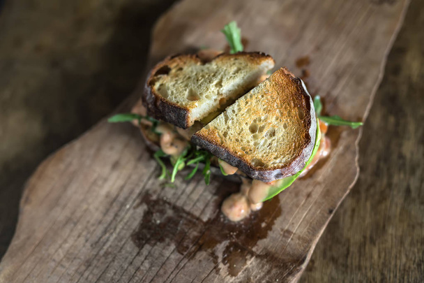 Roasted sandwich on wooden board - Photo, image