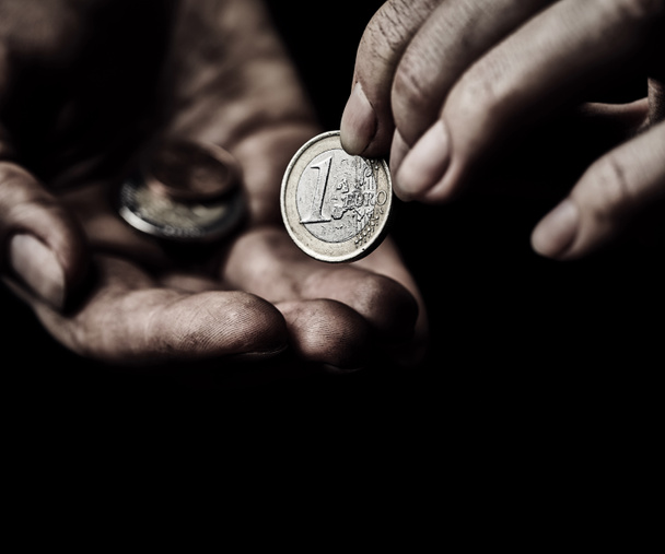 Manos de mendigo con monedas
 - Foto, Imagen