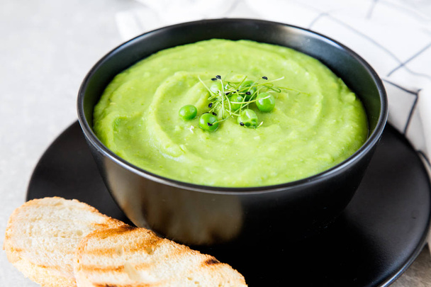 Homemade puree soup with green peas and micro greens.  - Photo, Image