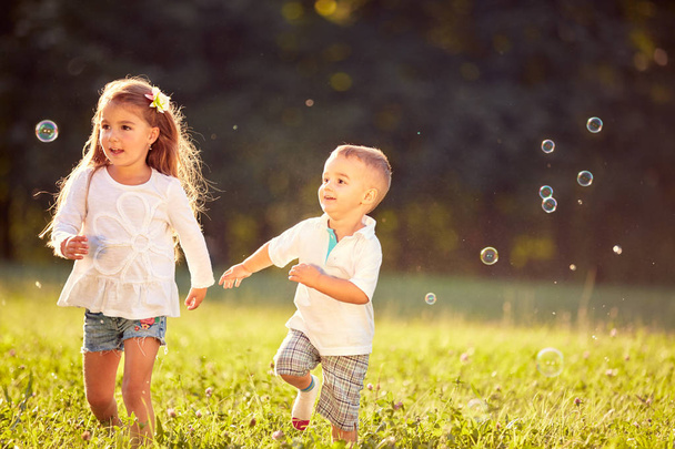 Cheerful children running together  - Fotó, kép