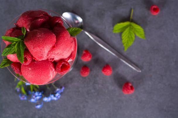Raspberry ice cream sorbet in glass with raspberry, mint leaves  - Photo, Image