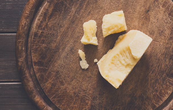 Cheese delikatessen on rustic wood desk, parmesan - Foto, Imagen
