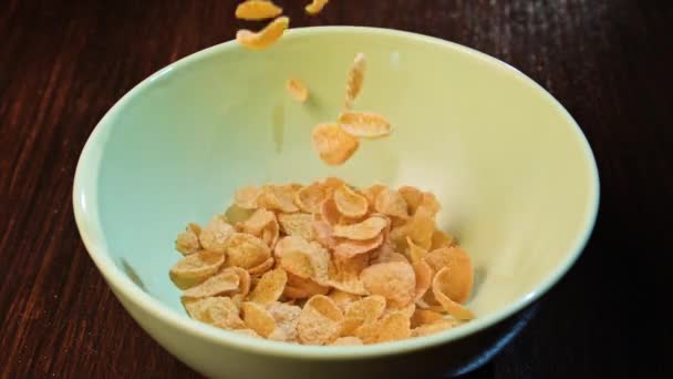 Cornflakes falling into a white ceramic bowl - Footage, Video