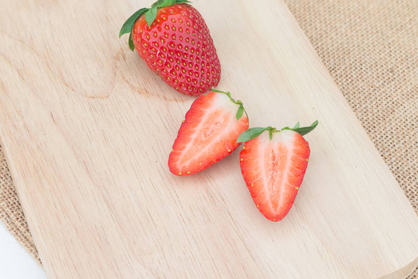  strawberry on rustic wooden plate - Фото, изображение