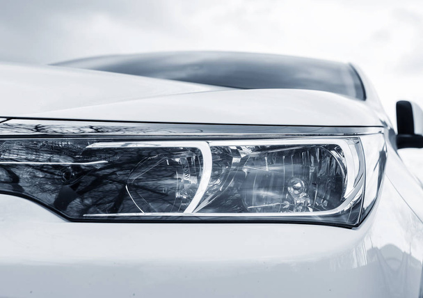 White car headlights. - Zdjęcie, obraz