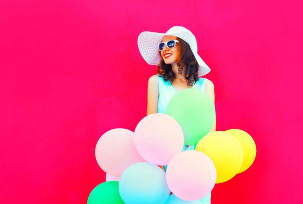 Fashion happy smiling young woman with an air colorful balloons  - Zdjęcie, obraz