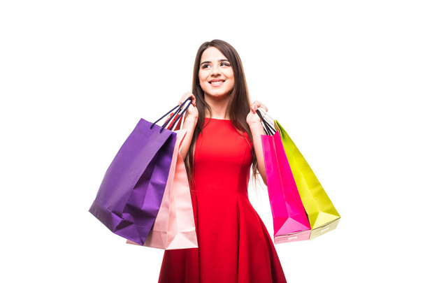 Beautiful young woman with bags, shopping concept, isolated on white background - Photo, Image