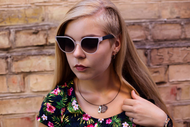 Blonde girl wearing glasses  on the street  - Foto, Imagem