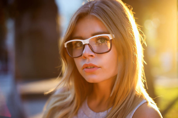 Blonde girl wearing glasses  on the street  - Photo, image