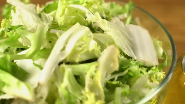 Vegetables ingridients for salad on rustic wooden background. - Filmagem, Vídeo