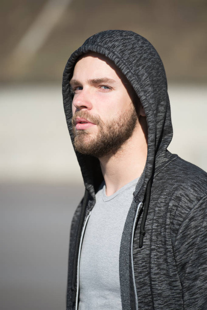 man in hood sunny outdoor, sport fashion - Photo, image