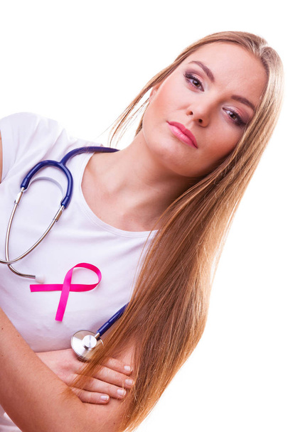Woman with pink ribbon aids symbol and stethoscope on chest. - Foto, Imagem