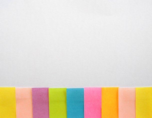 Colorful sticky notes on a white background with free text space - Фото, изображение