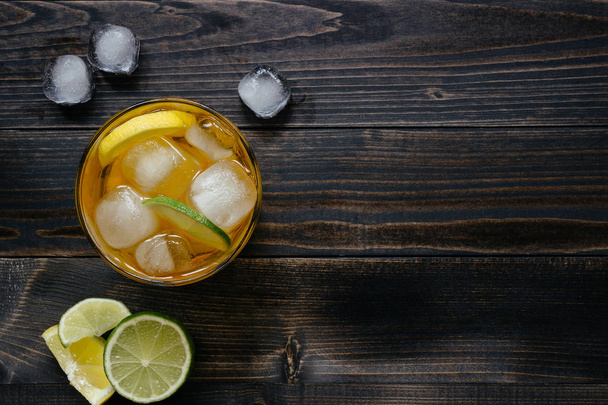 Fresh ice drink with lemon and lime on the wooden table, top view. With copy space - Φωτογραφία, εικόνα