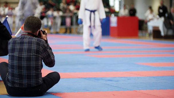 Photographers shoot during a karate competitions - Photo, Image