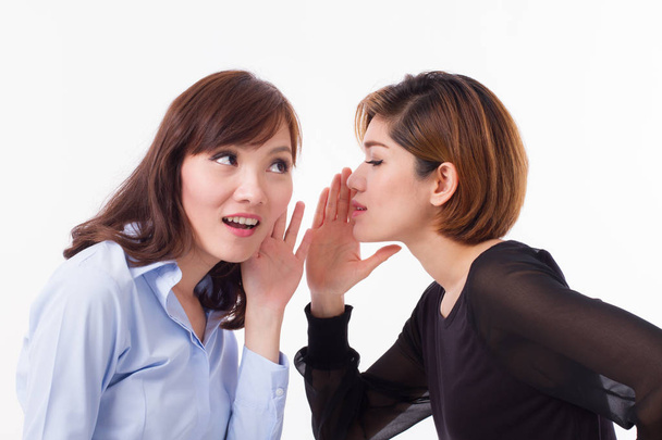 woman gossiping, whispering, listening to rumor or hearsay - Photo, Image