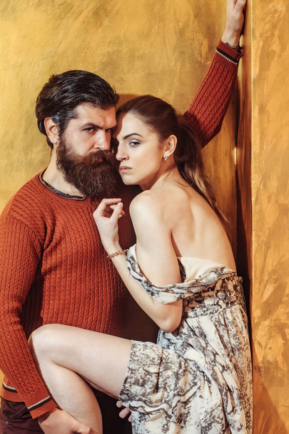 Pretty girl with closed eyes leaning on serious bearded man - Foto, immagini
