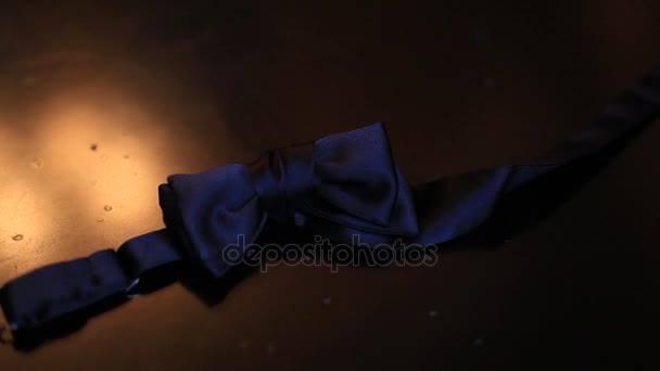 Bow tie on a wooden background - Footage, Video