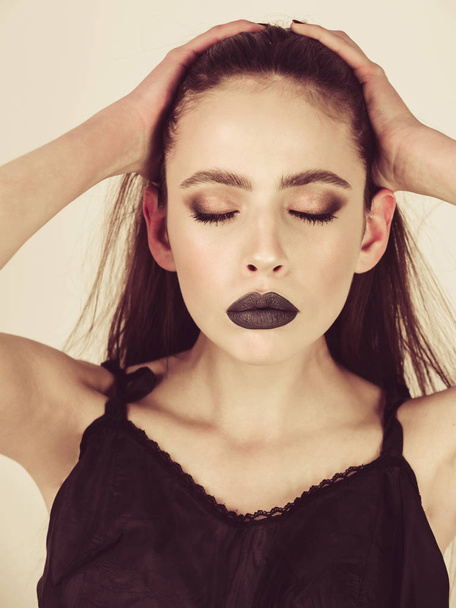 woman with black lips in dress has fashion makeup - 写真・画像