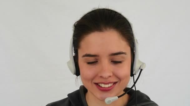Young woman talk in a headset - Materiaali, video