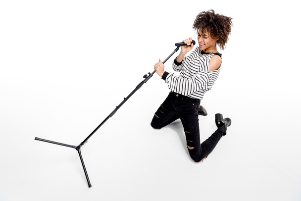 Young singer with microphone  - Photo, Image