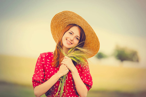 beautiful young woman with ears of wheat  - Photo, Image