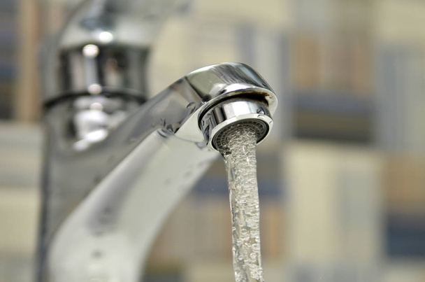 Opened water tap - Foto, afbeelding