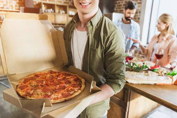 Young man with pizza - Photo, Image