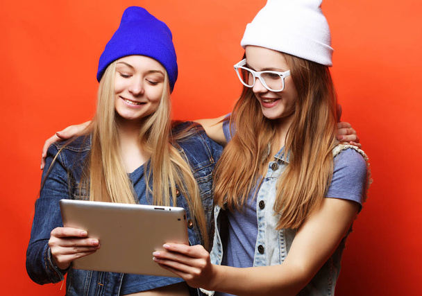 hipster girls friends taking selfie with digital tablet, studio - Фото, изображение
