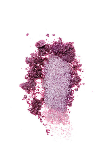 Smear of crushed violet eyeshadow as sample of cosmetic product - Photo, image