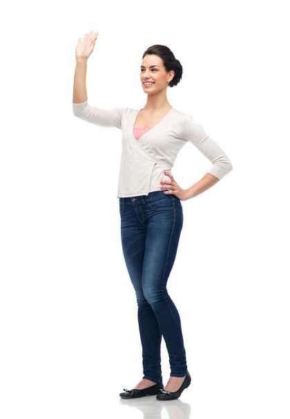happy smiling young woman waving hand over white - Φωτογραφία, εικόνα