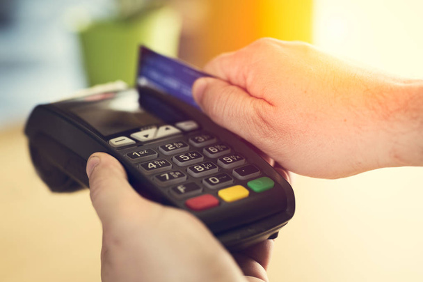 Hand Swiping Credit Card In Store - Fotó, kép