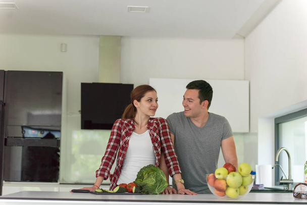 Young handsome couple in the kitchen - 写真・画像