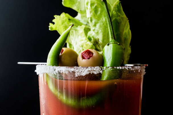 Bloody Mary Cocktail with green olive, pepper, lettuce, salt and ice - Valokuva, kuva