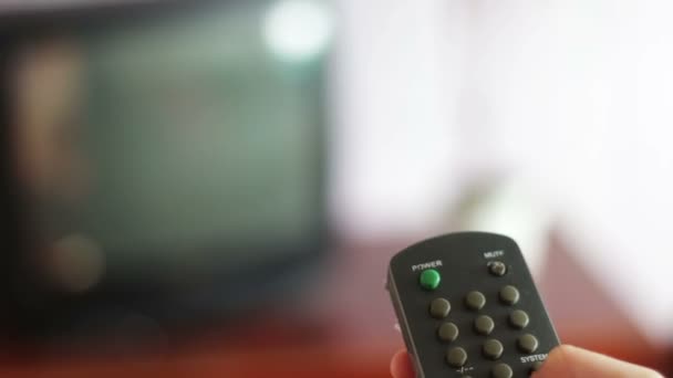 human hand changes the channels on the TV remote control - Footage, Video