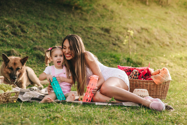 mother and daughter at a picnic - Photo, Image