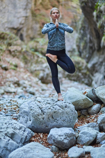 Young woman doing yoga   - Valokuva, kuva