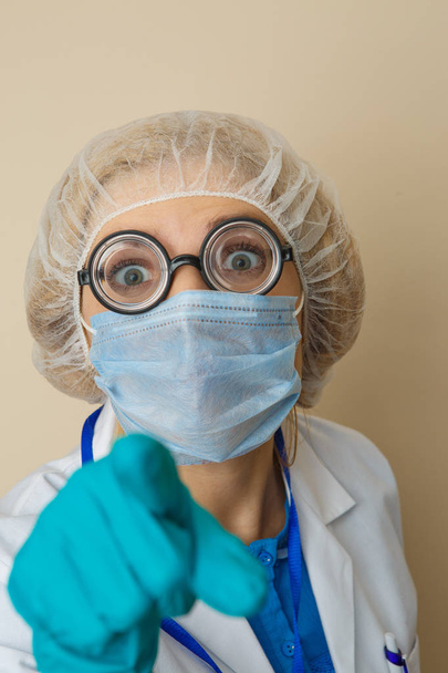 Young doctor in mask, glasses - Fotó, kép